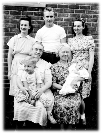 Back row: Naomi (my mother), Waldo (at about 16), Loraine Schindele (my dad's sister); Front row: Me sitting on grandma Matilda Erickson's lap (Waldo's mother), Agnus Schindele (my other grandma) holding brother Robert 